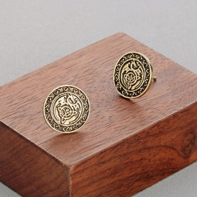 pendientes dragones